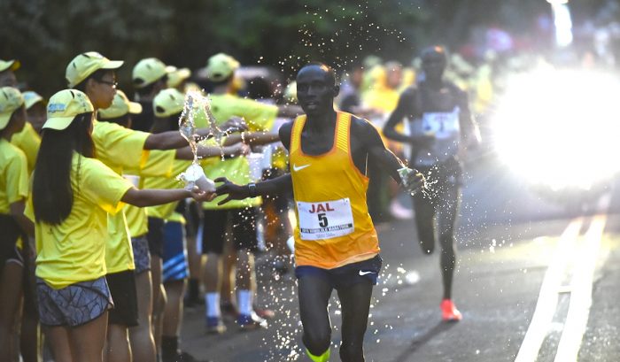 Honolulu Marathon's Men's first place finisher Sunday, Dec. 11, 2016, Lawrence Cherono chased by Wilson Chebet.