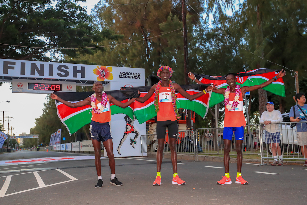 HONOLULU, HI - DECEMBER 09:  Three Kenyans finish 1st (Titus Ekiru: Center), 2nd (Reuben Kerio: Right), 3rd (Vincent Yator: Left) places during the Honolulu Marathon 2018 on December 9, 2018 in Honolulu, Hawaii.  (Photo by Tom Pennington/Getty Images for HONOLULU MARATHON) *** Local Caption *** Titus Ekiru; Reuben Kerio; Vincent Yator